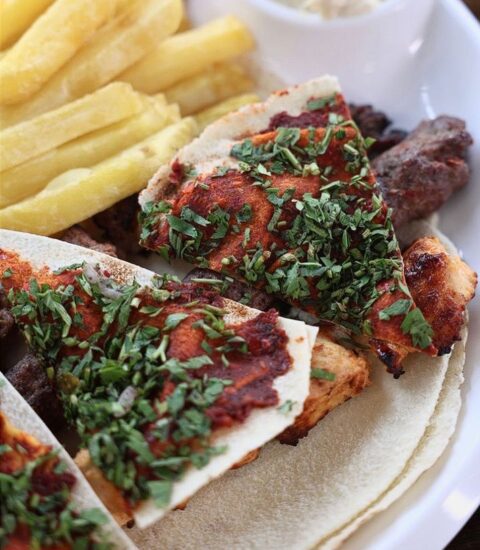 Machewe Express, image of grilled meat plate with vegetables and fries