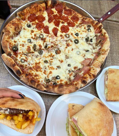 Royal Pizza, image of pizza and submarine plates