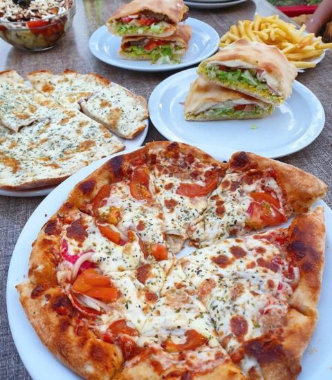 Royal pizza, image of pizza and submarine plates in the restaurant