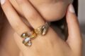 Jewelry Khoury, image of a woman showcasing two golden rings