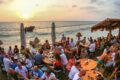 Pierre and Friends, image next to the beach with customers eating and admiring the sunset