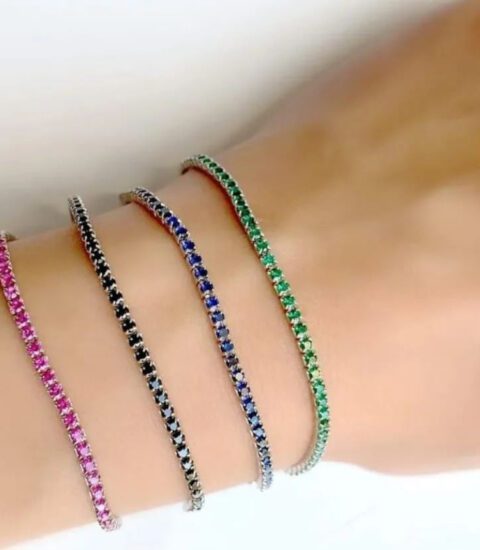 Trois Quart, image of a woman's hand showcasing bracelet accessories