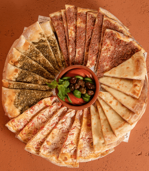 Furn Merchak, image of different kinds of manouche, zaatar, cheese, ham and pepper