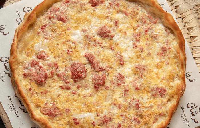 Furn-Merchak, image of manouche of eggs and sausages