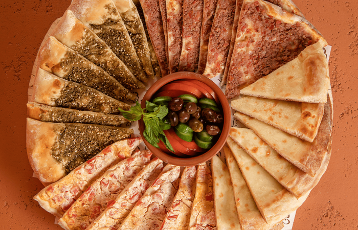 Furn Merchak, image of different kinds of manouche, zaatar, cheese, ham and pepper
