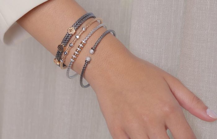 Farah El Khoury Jewelry, image of hand wearing white golden bracelet