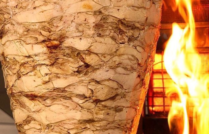 Machewe Express, image of grilled Shawarma in an open furnace