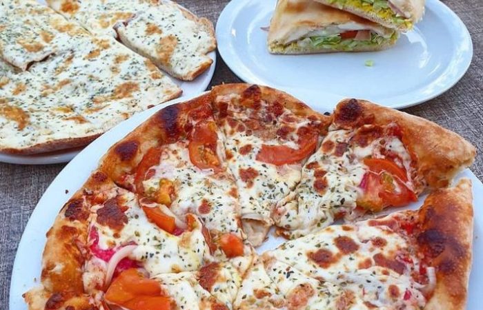 Royal pizza, image of pizza and submarine plates in the restaurant