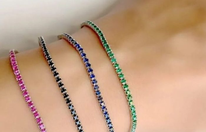 Trois Quart, image of a woman's hand showcasing bracelet accessories